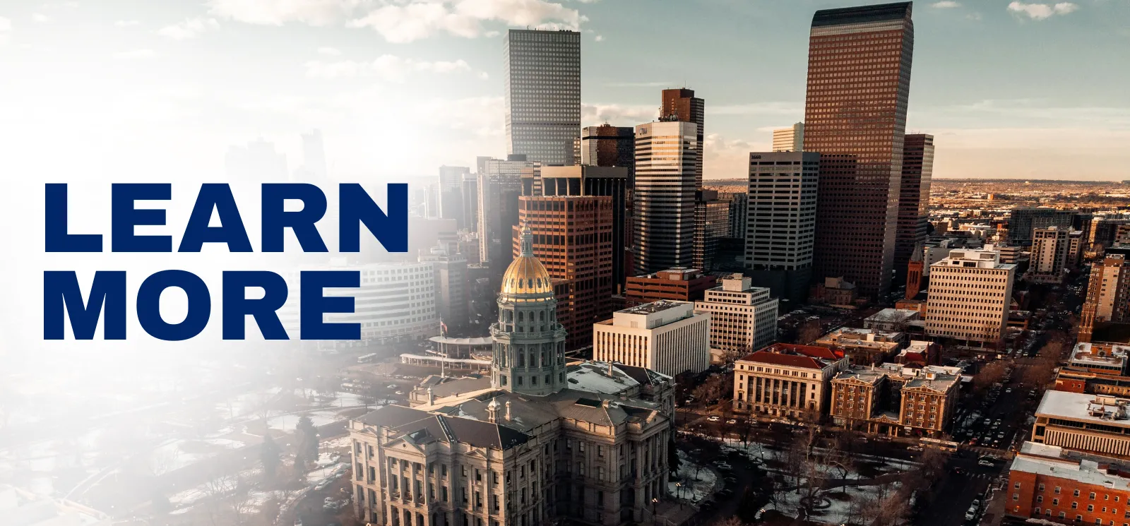 "Learn more" superimposed over the Denver skyline